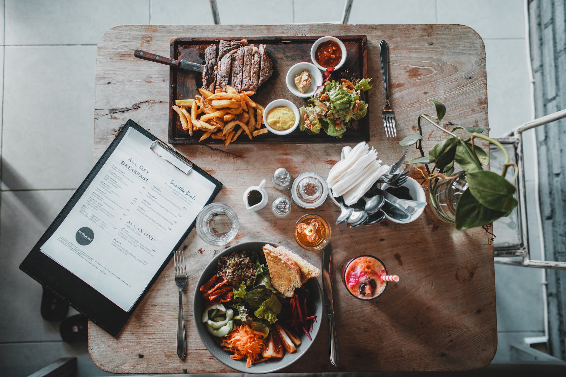 vegetable salad served on table with beef steak in restaurant